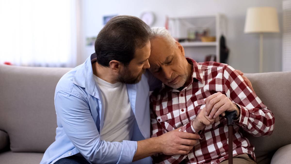 An older patient and a family member discuss the advance directive